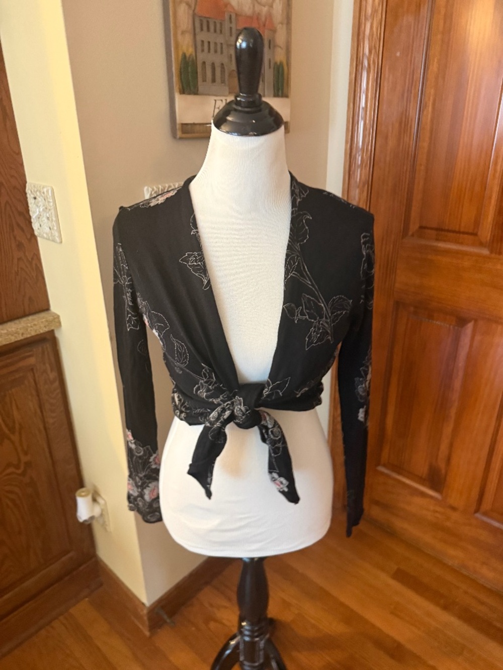 Black draped cardigan with floral print
